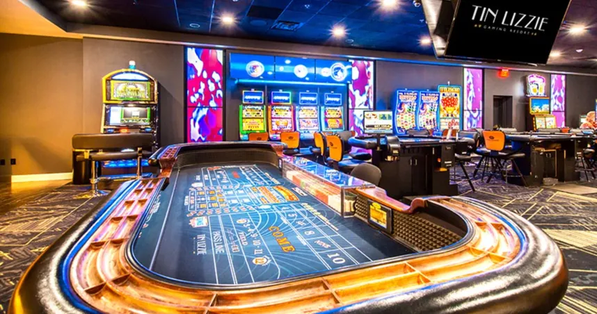 Casino floor at Tin Lizzie Gaming Resort in South Dakota with slot machines and table games